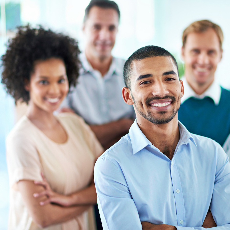 Portrait of a group of diverse colleagues standing in an office