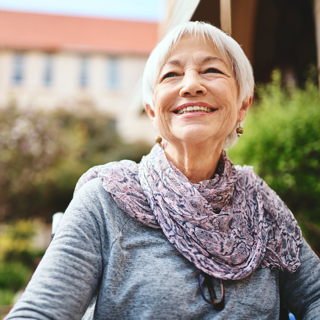 Shot of a senior woman relaxing outside in the garden of a retirement home